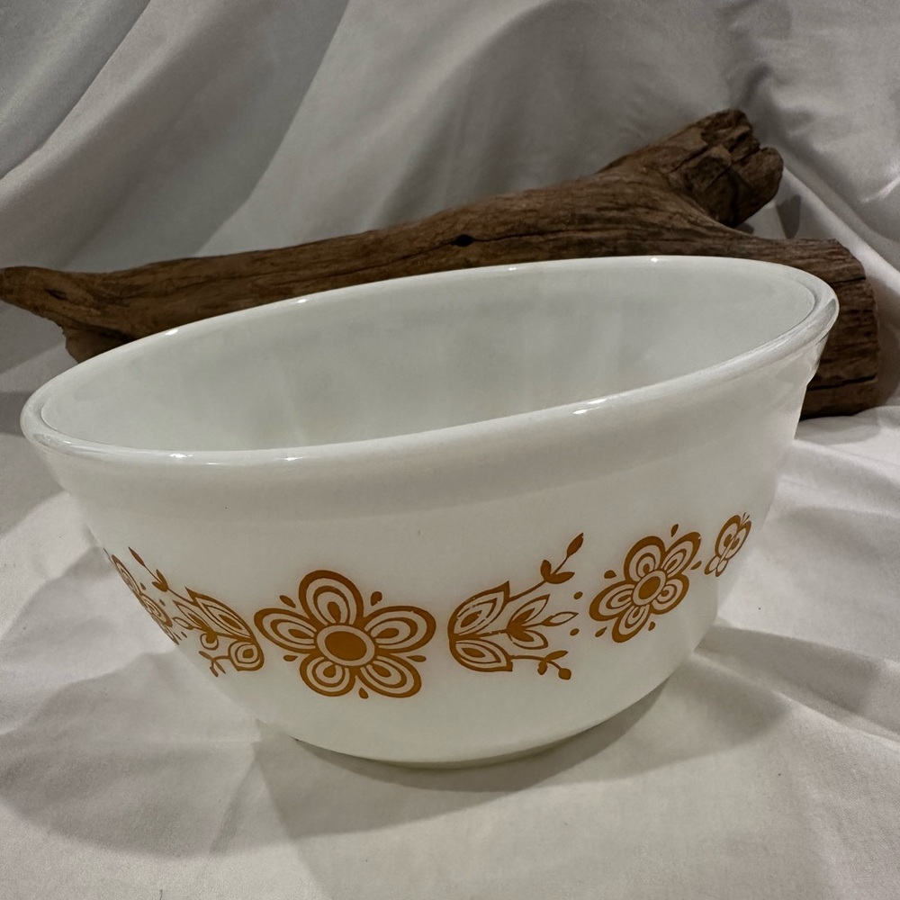 Vintage Pyrex mixing bowl in the "Butterfly Gold" pattern.